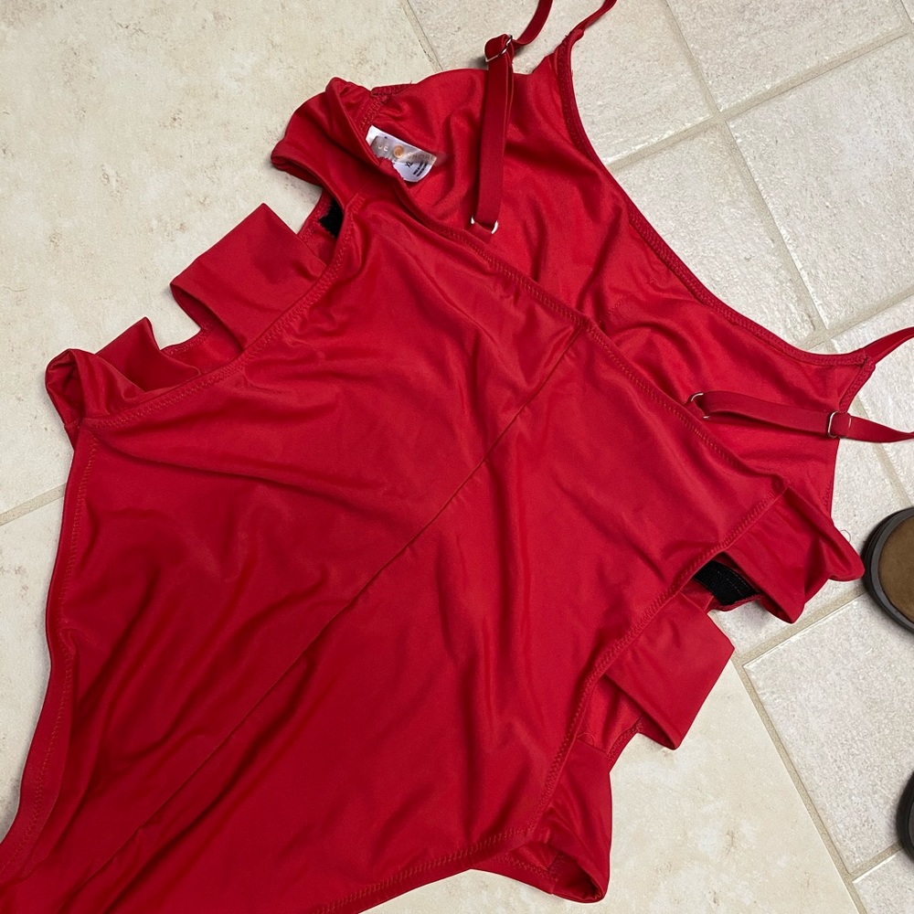 Red one piece with cut out sides